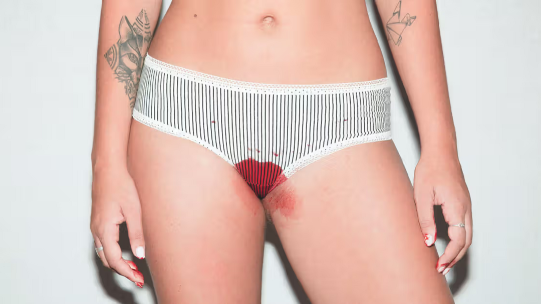 Lower part of body showing underwear with blood 